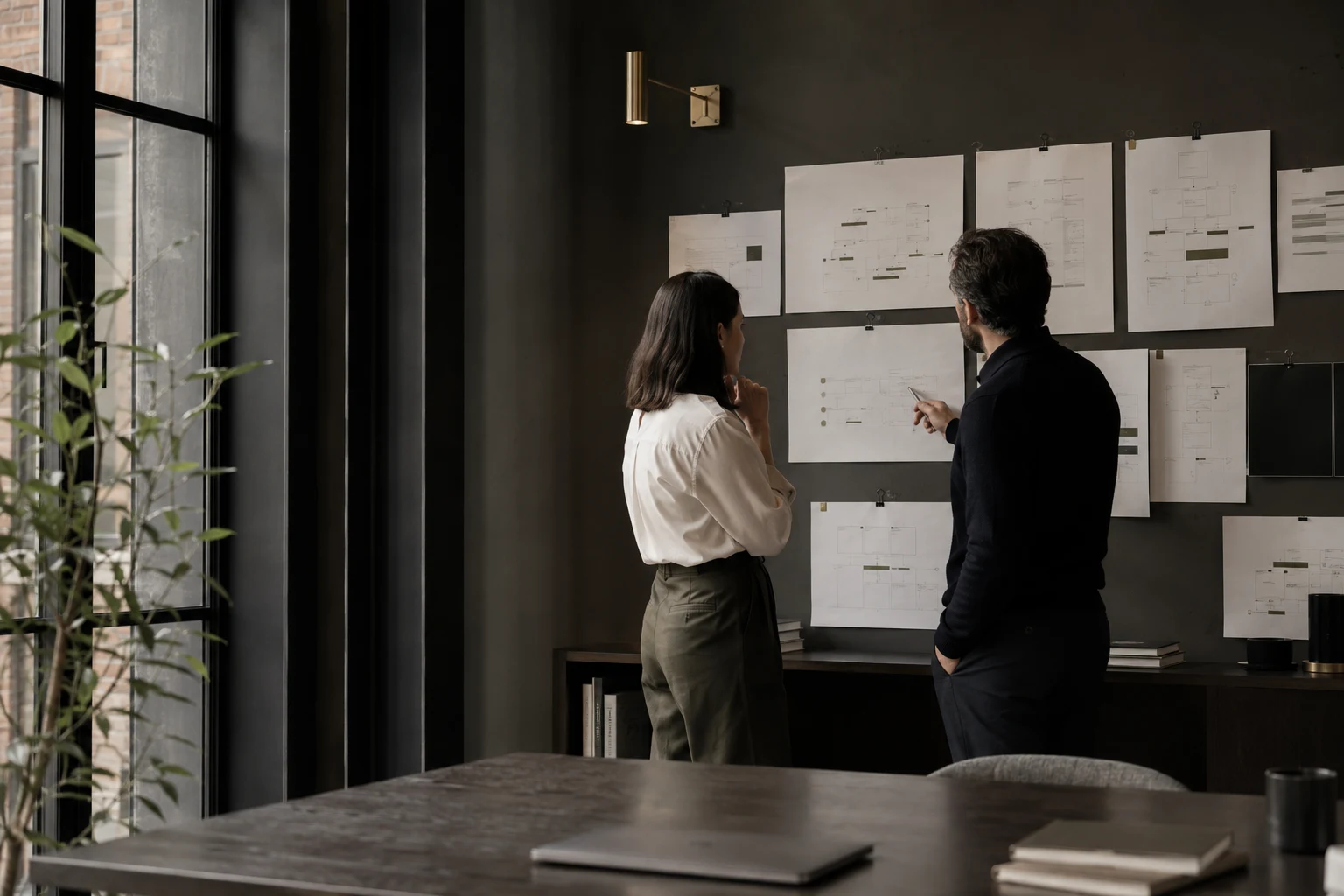 Professionals reviewing a workflow together in an office.