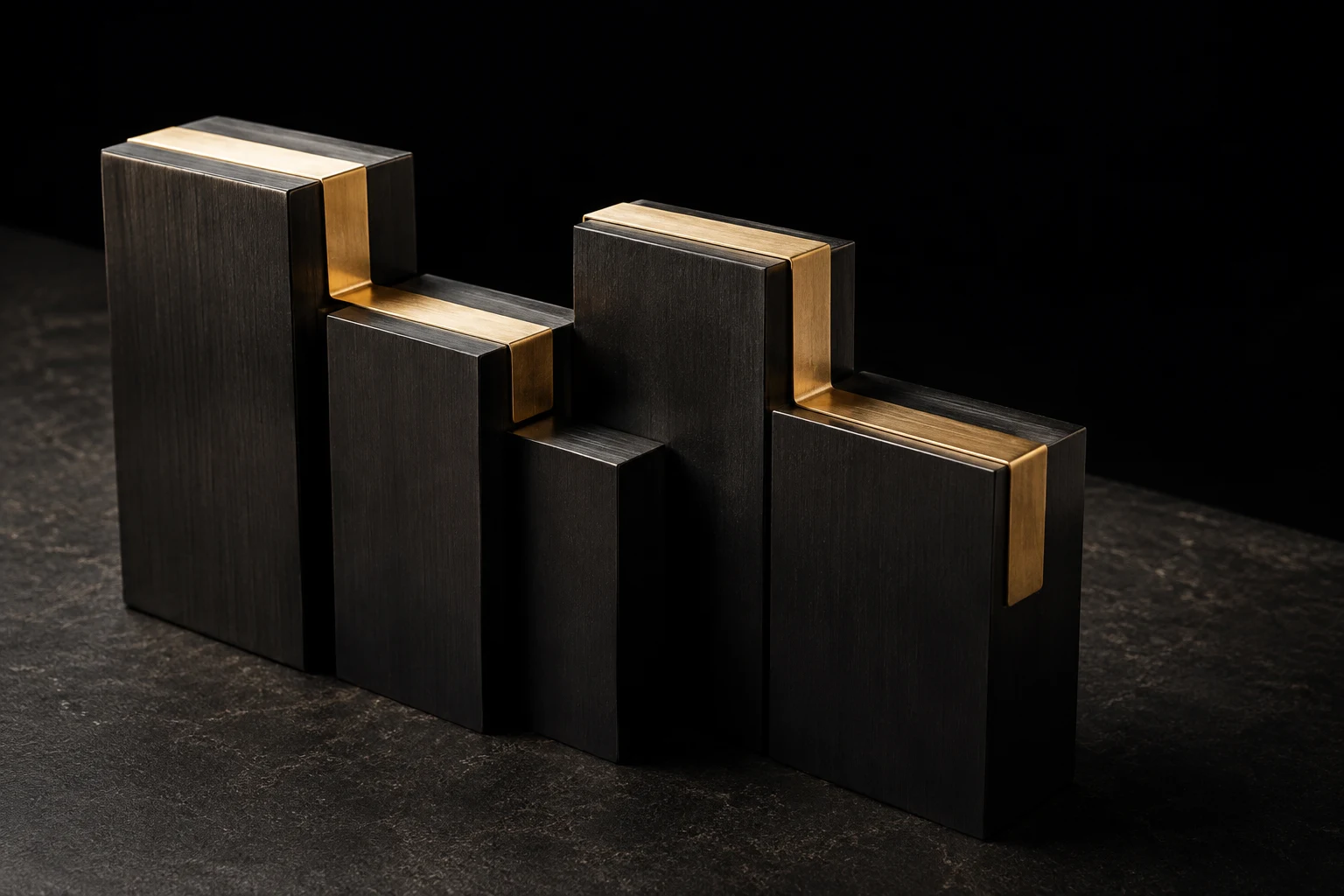 A continuous brass connection joining a series of dark metal forms.